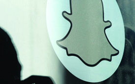 VENICE, CA-NOVEMBER-14: Logo of Snapchat is seen at the front entrance new headquarters of Snapchat , the popular social network startup that lets users send each other photos that quickly disappear, November 14, 2013 in Venice, California. Snapchat recently turned down a $3-billion buyout offer from Facebook. (Photo by Kevork Djansezian/Getty Images)