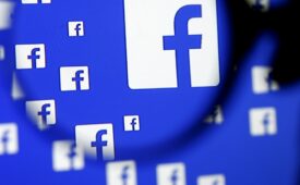A man poses with a magnifier in front of a Facebook logo on display in this illustration taken in Sarajevo, Bosnia and Herzegovina, December 16, 2015.   REUTERS/Dado Ruvic/Illustration/File Photo   GLOBAL BUSINESS WEEK AHEAD PACKAGE - SEARCH "BUSINESS WEEK AHEAD JULY 25" FOR ALL IMAGES - RTSJGEL