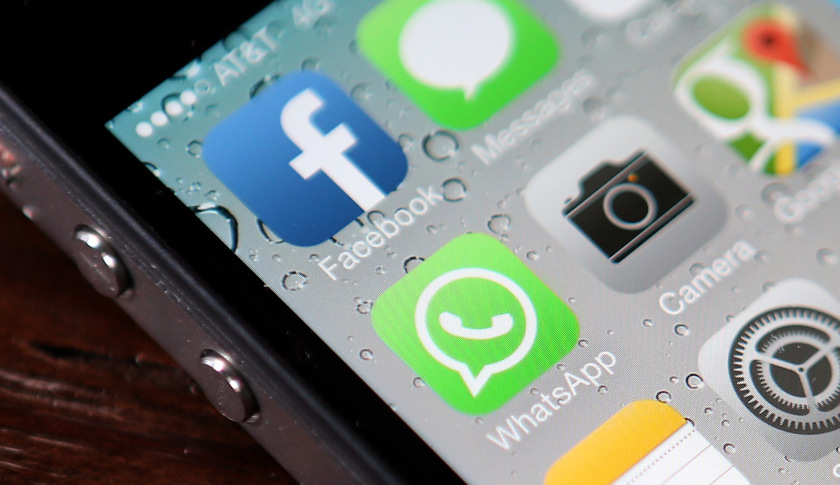 SAN FRANCISCO, CA - FEBRUARY 19: The Facebook and WhatsApp app icons are displayed on an iPhone on February 19, 2014 in San Francisco City. Facebook Inc. announced that it will purchase smartphone-messaging app company WhatsApp Inc. for $19 billion in cash and stock. (Photo illustration by Justin Sullivan/Getty Images)