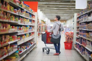 shopping woman in supermarket store buying food and grocery