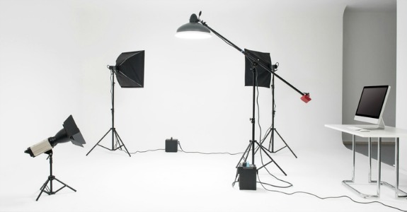 Professional photo studio with flash lights, stands, camera and background equipments