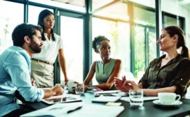 Shot of a group of colleagues having a meeting in a modern office