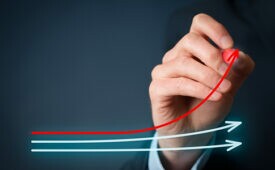 Benchmarking and market leader concept. Manager (businessman, coach, leadership) draw graph with three lines, one of them represent the best company in competition.