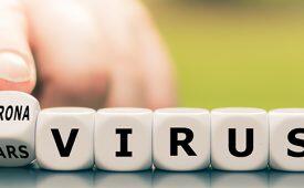 Hand turns a dice and changes the expression "sars virus" to "corona virus".