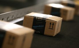 TRACY, CA - JANUARY 20:  Boxes move along a conveyor belt at an Amazon fulfillment center on January 20, 2015 in Tracy, California. Amazon officially opened its new 1.2 million square foot fulfillment center in Tracy, California that employs more than 1,500 full time workers as well as 3,000 Kiva robots that can fetch merchandise for workers and are capable of lifting up to 750 pounds. Amazon is currently using 15,000 of the robots spread over 10 fulfillment centers across the country.  (Photo by Justin Sullivan/Getty Images)