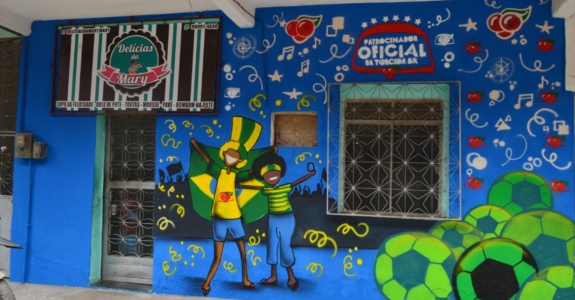 Campanha do Guaraná para a Copa do Mundo envolveu grafite em muros de comunidades (Crédito: Divulgação/Novo Outdoor Social)